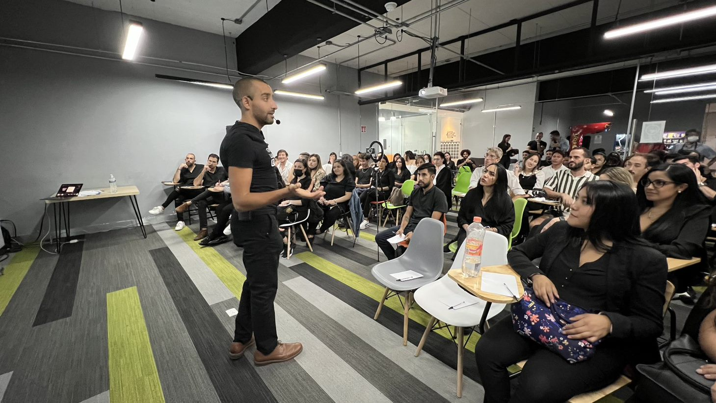 Carlos Agami leading a workshop for an audience