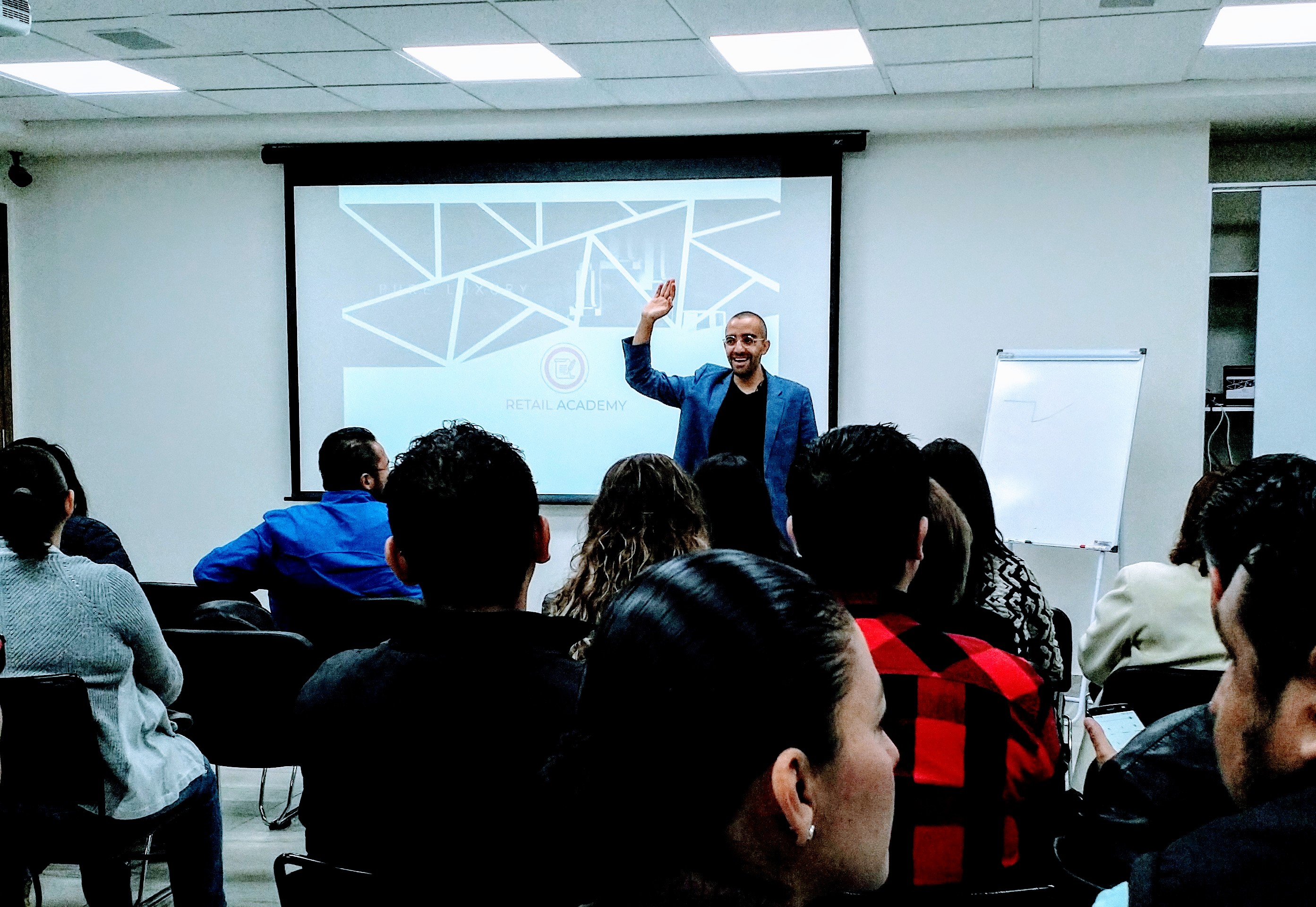 Carlos Agami working with a sales team during a training session